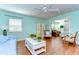 Open-concept living area with hardwood floors and seamless flow to other rooms at 1324 Eckles Dr, Tampa, FL 33612