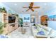 Open living area with tile floors, neutral paint, ceiling fan and large tv for Gathering enjoyment at 1324 Eckles Dr, Tampa, FL 33612