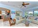 Open floor plan featuring living room with white couches and view to the kitchen, dining room and water at 1324 Eckles Dr, Tampa, FL 33612