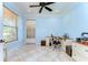 Home office featuring tile floors, white trim, a ceiling fan, and natural light at 1324 Eckles Dr, Tampa, FL 33612