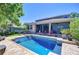 In-ground pool and brick patio with lounge seating, landscaping, and a view of the screened-in lanai at 1324 Eckles Dr, Tampa, FL 33612