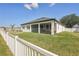 This backyard has a well-maintained lawn and screened in patio at 13355 Palmerston Rd, Riverview, FL 33579