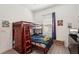 Comfortable bedroom features a cozy bunk bed, soft lighting, and a vibrant accent curtain at 13355 Palmerston Rd, Riverview, FL 33579