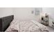 This bedroom features a comfortable queen-sized bed and a decorative accent table at 13355 Palmerston Rd, Riverview, FL 33579