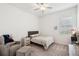 Cozy bedroom featuring a neutral color palette, a comfortable chair and soft natural light at 13355 Palmerston Rd, Riverview, FL 33579