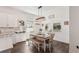 Bright dining area with a wood table, bench seating, and natural light from the windows at 13355 Palmerston Rd, Riverview, FL 33579