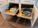 Under-cabinet storage featuring pull-out shelves maximizing organization of pots and pans in this modern kitchen at 13355 Palmerston Rd, Riverview, FL 33579
