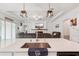 Bright open concept kitchen with stainless steel appliances and pendant lighting overlooking living room at 13355 Palmerston Rd, Riverview, FL 33579