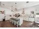 Spacious kitchen featuring a large island with seating, white cabinets, and modern appliances at 13355 Palmerston Rd, Riverview, FL 33579