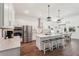 Bright kitchen featuring a central island with stool seating, stainless steel appliances, and pendant lighting at 13355 Palmerston Rd, Riverview, FL 33579