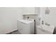 Efficient laundry room equipped with modern washer, dryer, sink and storage cabinets at 13355 Palmerston Rd, Riverview, FL 33579