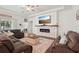 Inviting living room with a modern fireplace, stylish furnishings, and a ceiling fan at 13355 Palmerston Rd, Riverview, FL 33579