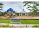 A playground is featured complete with a variety of slides and swings for residents to enjoy at 13355 Palmerston Rd, Riverview, FL 33579