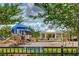 Fun playground area surrounded by lush greenery, perfect for Gathering enjoyment and outdoor activities at 13355 Palmerston Rd, Riverview, FL 33579