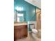 Well-lit bathroom with a granite countertop vanity and a tiled walk-in shower at 1505 Trailwater St, Ruskin, FL 33570