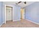Cozy bedroom with neutral carpet, closet with a wire rack, and a doorway to the rest of the home at 1505 Trailwater St, Ruskin, FL 33570