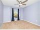 Serene bedroom features a ceiling fan and a window with neutral color scheme at 1505 Trailwater St, Ruskin, FL 33570