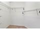 Walk-in closet featuring carpeted flooring and wire rack shelving for organized storage at 1505 Trailwater St, Ruskin, FL 33570
