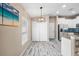 Bright kitchen and dining area featuring a modern light fixture and stainless steel appliances at 1505 Trailwater St, Ruskin, FL 33570