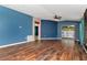 Living room featuring stylish wood floors and a sliding door leading to the outdoors at 1505 Trailwater St, Ruskin, FL 33570