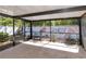 Spacious screened patio ideal for enjoying the outdoors with plants and a privacy fence at 1505 Trailwater St, Ruskin, FL 33570