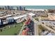 Beautiful aerial view of waterfront townhomes with docks near pristine beach and commercial area at 159 Medallion Blvd # H, Madeira Beach, FL 33708