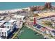 Gorgeous aerial shot of waterfront townhomes featuring private boat docks with convenient beach access at 159 Medallion Blvd # H, Madeira Beach, FL 33708