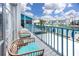 Enjoy the water view from this condo's private balcony with outdoor seating at 159 Medallion Blvd # H, Madeira Beach, FL 33708