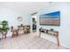 Open living area with adjacent dining space and modern entertainment at 159 Medallion Blvd # H, Madeira Beach, FL 33708