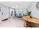 Charming living room with ceiling fan, tile flooring and nautical decor at 159 Medallion Blvd # H, Madeira Beach, FL 33708