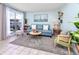 Cozy living room with waterfront views, comfortable seating, and stylish coastal decor at 159 Medallion Blvd # H, Madeira Beach, FL 33708