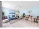 Living room featuring ceiling fan and views from windows at 159 Medallion Blvd # H, Madeira Beach, FL 33708