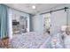 Bright main bedroom with en-suite bathroom, balcony access, and stylish sliding door at 159 Medallion Blvd # H, Madeira Beach, FL 33708