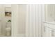 Clean bathroom features a shower, toilet, and vanity with modern fixtures at 17512 Shirewood Way, Land O Lakes, FL 34638