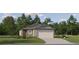 Charming one-story home with neutral siding, a two-car garage, and a well-manicured lawn at 17512 Shirewood Way, Land O Lakes, FL 34638