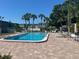Inviting community pool surrounded by lush landscaping, perfect for relaxation at 1799 N Highland Ave # 32, Clearwater, FL 33755