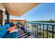 Balcony featuring a relaxing seating area, offering views of the canal, and a space for enjoying the outdoor scenery at 18201 Gulf Blvd # 201, Redington Shores, FL 33708