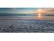 Beach with wet sand near the waterline, view to the horizon at 18201 Gulf Blvd # 201, Redington Shores, FL 33708