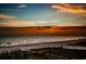 Beautiful sunset view over the beach showing stunning colors of the horizon and silhouettes of people enjoying the ocean at 18201 Gulf Blvd # 201, Redington Shores, FL 33708