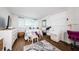Bedroom featuring a dresser, a bed with throw pillows, and hardwood floors at 18201 Gulf Blvd # 201, Redington Shores, FL 33708