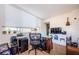 Bright bedroom with windows, hardwood floors, and a glass desk at 18201 Gulf Blvd # 201, Redington Shores, FL 33708