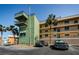 Condo building exterior with parking spots and balconies at 18201 Gulf Blvd # 201, Redington Shores, FL 33708