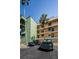 Exterior view of condo building with parking for tenants at 18201 Gulf Blvd # 201, Redington Shores, FL 33708