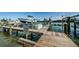 Waterfront dock area with boat lift, offering easy access to the water at 18201 Gulf Blvd # 201, Redington Shores, FL 33708