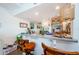 Breakfast bar with granite countertops, wooden barstools, and modern lighting fixtures at 18201 Gulf Blvd # 201, Redington Shores, FL 33708
