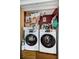 Compact laundry area with stacked washer and dryer for efficient space saving at 18201 Gulf Blvd # 201, Redington Shores, FL 33708