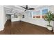 Open floorplan living room with a water view, wood-style floors, shutters, and decorative ceiling at 18201 Gulf Blvd # 201, Redington Shores, FL 33708