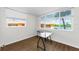 Office features water views and a glass desk with wood-style flooring, and natural light at 18201 Gulf Blvd # 201, Redington Shores, FL 33708