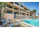 Community pool with lounge chairs for residents to enjoy at 18201 Gulf Blvd # 201, Redington Shores, FL 33708