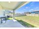 Enjoy outdoor living on the covered patio with a grill overlooking the fenced-in yard at 22223 Storybook Cabin Way, Land O Lakes, FL 34637